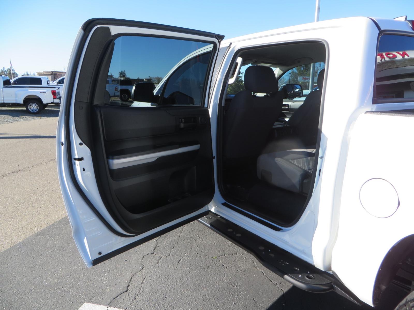 2020 White /GREY Toyota Tundra SR5 (5TFDY5F19LX) with an 5.7L engine, automatic transmission, located at 2630 Grass Valley Highway, Auburn, CA, 95603, (530) 508-5100, 38.937893, -121.095482 - Features - King Off Road adjustable remote reservoir coil overs, King 2.5 adjustable remote reservoir rear shocks, Method Race wheels, Falken Wildpeak tires, Sliders, Bed braces, Borla Exhaust, Husky floor mats, Window tint, and Ram phone mounts. - Photo #32